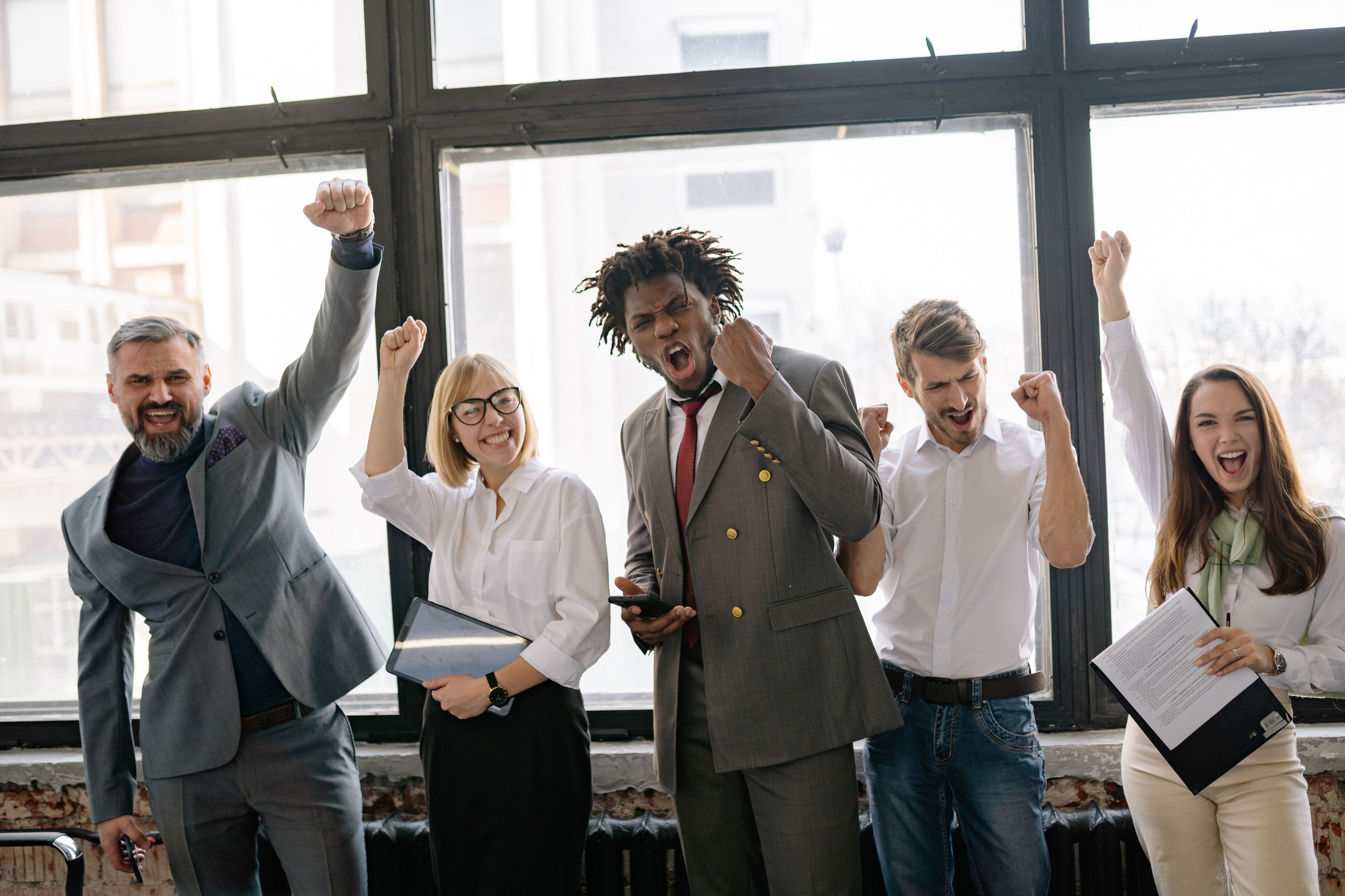 ACAMS corporate professionals celebrating exam success with CAMSExam